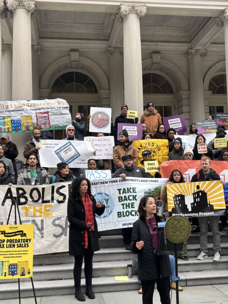 A group rallies in front of a government building